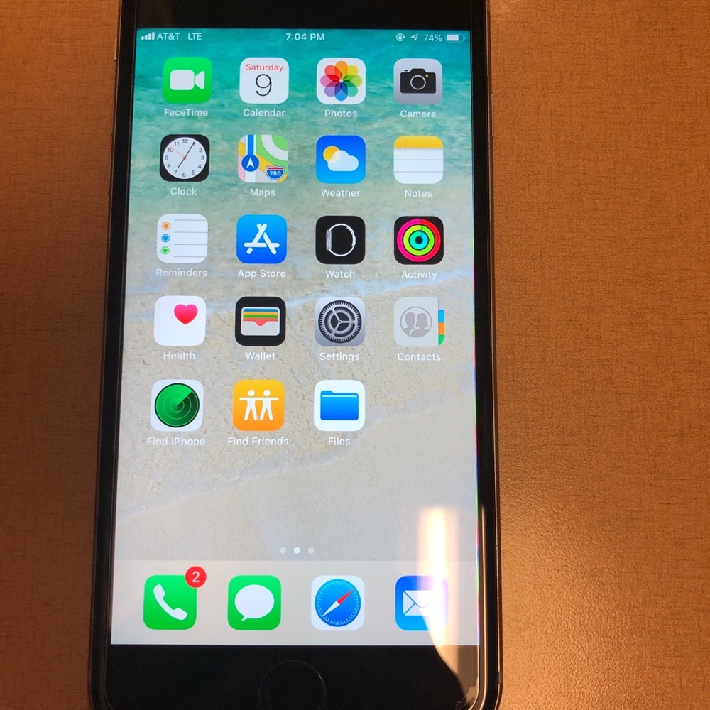 IPhone 6s Plus with charger and cases